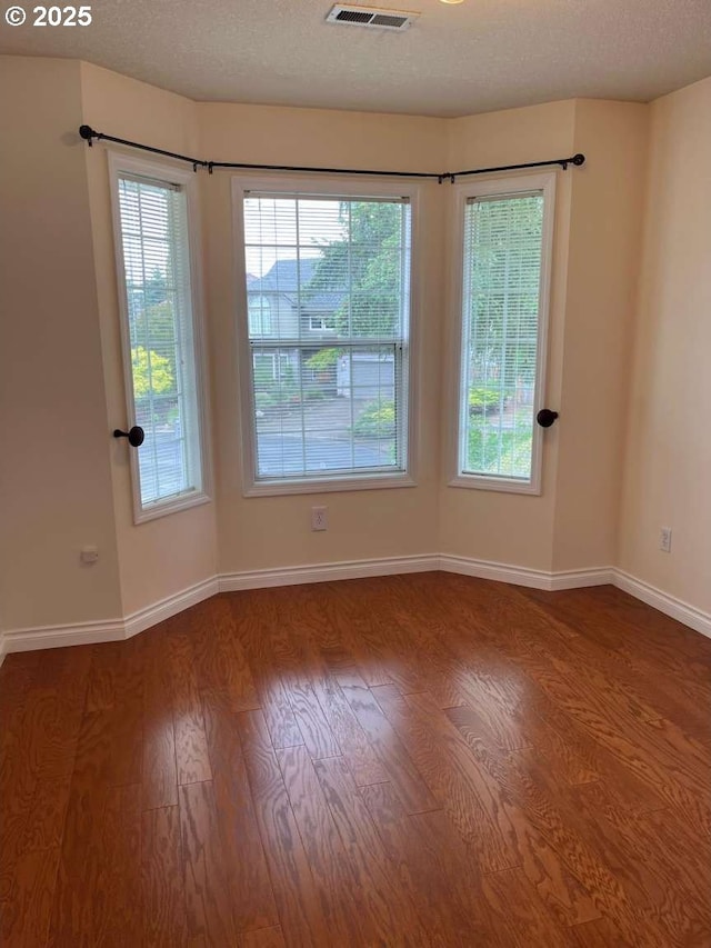 3553 NW 163rd Ct, Beaverton, OR 97006 - unfurnished room featuring wood finished floors and plenty of natural light