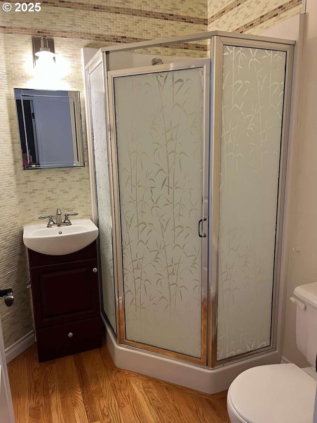 3553 NW 163rd Ct, Beaverton, OR 97006 - bathroom with wood finished floors, vanity, and a shower stall