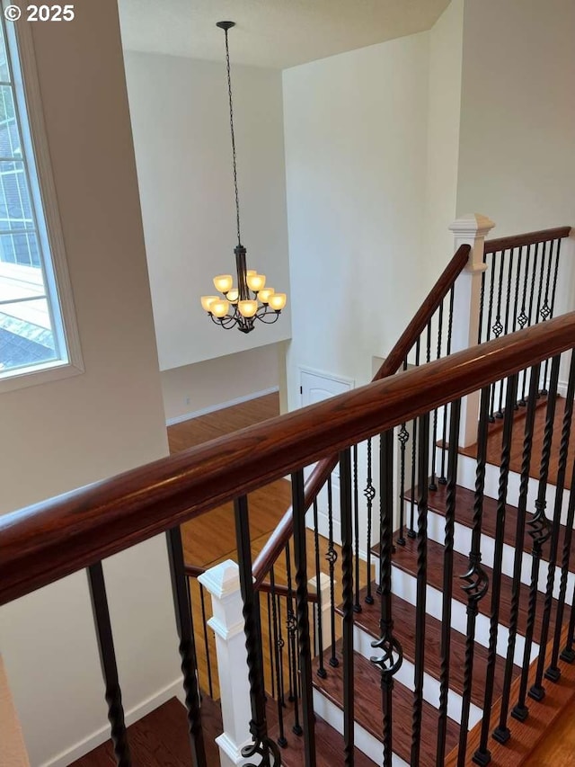 3553 NW 163rd Ct, Beaverton, OR 97006 - stairs with a chandelier and wood finished floors