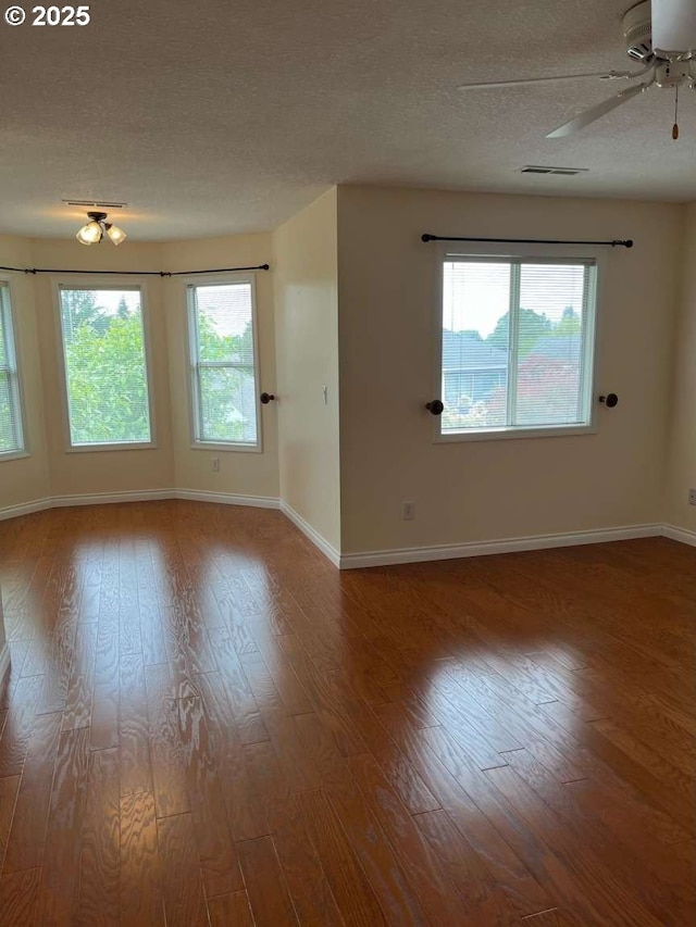 3553 NW 163rd Ct, Beaverton, OR 97006 - spare room with a textured ceiling, wood finished floors, and a ceiling fan