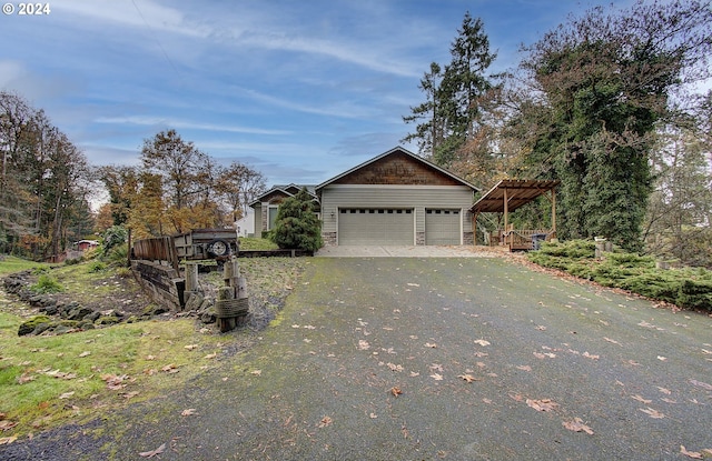 33015 School St, Rainier, OR 97048 - view of side of property featuring asphalt driveway and a garage