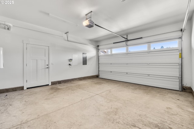 2522 S Lydia Loop, Hubbard, OR 97032 - garage featuring electric panel, a garage door opener, and baseboards