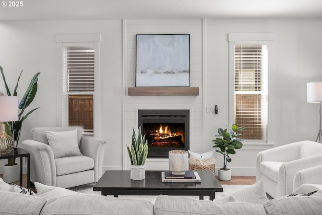 2522 S Lydia Loop, Hubbard, OR 97032 - living room featuring a fireplace, wood finished floors, and baseboards