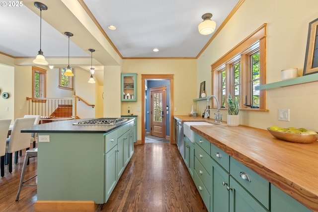 17367 Canal Cir, Lake Oswego, OR 97035 - kitchen with a sink, green cabinetry, dark wood-type flooring, ornamental molding, and butcher block countertops