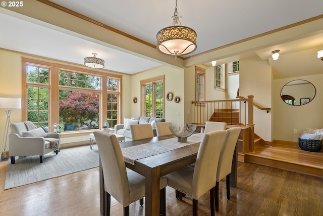 17367 Canal Cir, Lake Oswego, OR 97035 - dining space with stairs, wood finished floors, crown molding, and baseboards