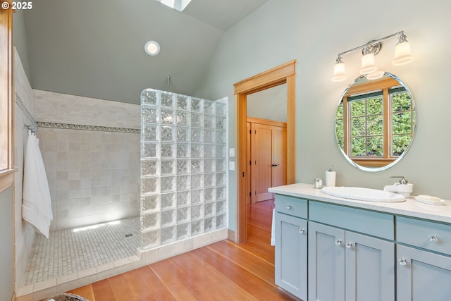 17367 Canal Cir, Lake Oswego, OR 97035 - bathroom featuring walk in shower, wood finished floors, vanity, and lofted ceiling