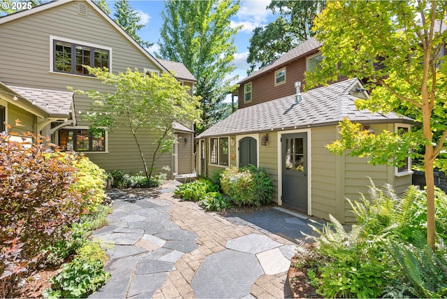 17367 Canal Cir, Lake Oswego, OR 97035 - back of property with an outbuilding, a patio, and a shingled roof