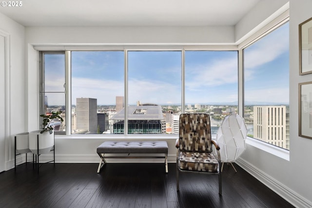 sunroom / solarium featuring a city view