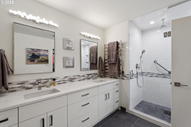 full bathroom with a stall shower, double vanity, tile patterned floors, and recessed lighting