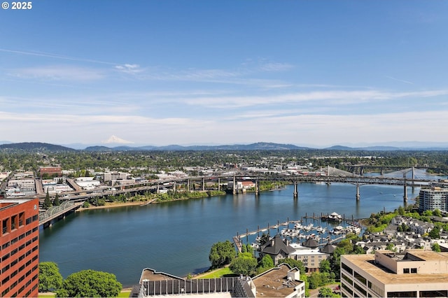 water view with a notable bridge and a mountain backdrop