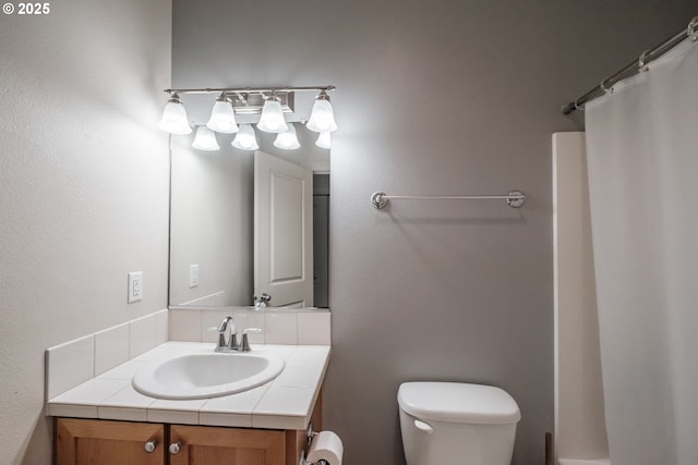 full bath with vanity, toilet, and a shower with shower curtain