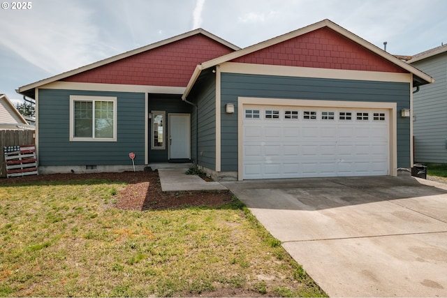 view of front facade featuring a garage, fence, driveway, and a front yard