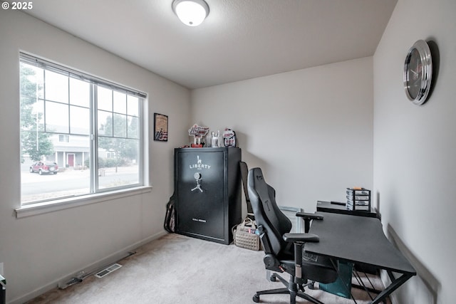 office area with carpet floors, baseboards, and visible vents
