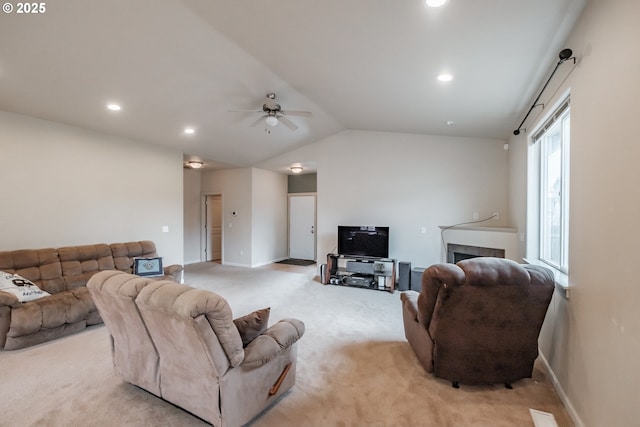 living room with baseboards, recessed lighting, ceiling fan, and light carpet