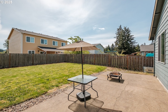 view of patio featuring a fenced backyard and an outdoor fire pit