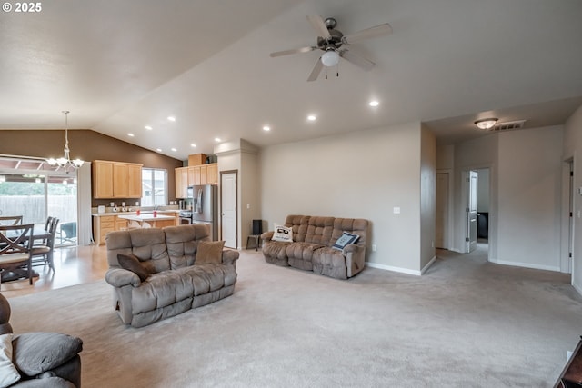 living area featuring ceiling fan with notable chandelier, recessed lighting, baseboards, vaulted ceiling, and visible vents