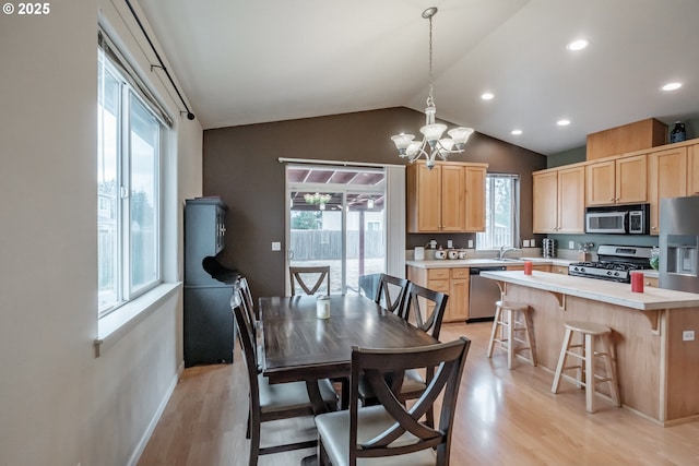 dining room with lofted ceiling, baseboards, light wood-type flooring, recessed lighting, and a notable chandelier