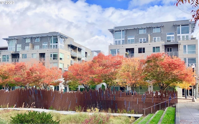 view of building exterior with fence