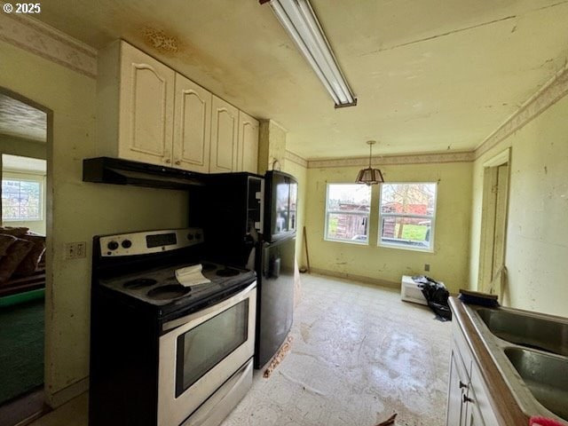 kitchen with pendant lighting, white electric range oven, plenty of natural light, and sink