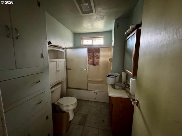 full bathroom featuring vanity, bath / shower combo with glass door, and toilet