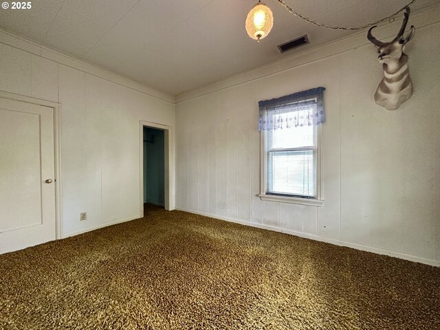 808 F Ave, La Grande, OR 97850 - empty room with dark carpet and crown molding