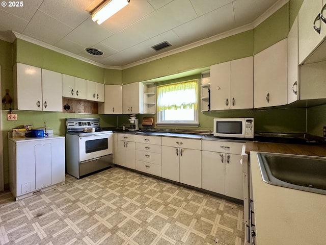 808 F Ave, La Grande, OR 97850 - kitchen featuring electric range, open shelves, white microwave, light floors, and ornamental molding