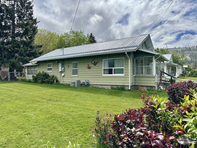 808 F Ave, La Grande, OR 97850 - back of property featuring central AC unit and metal roof