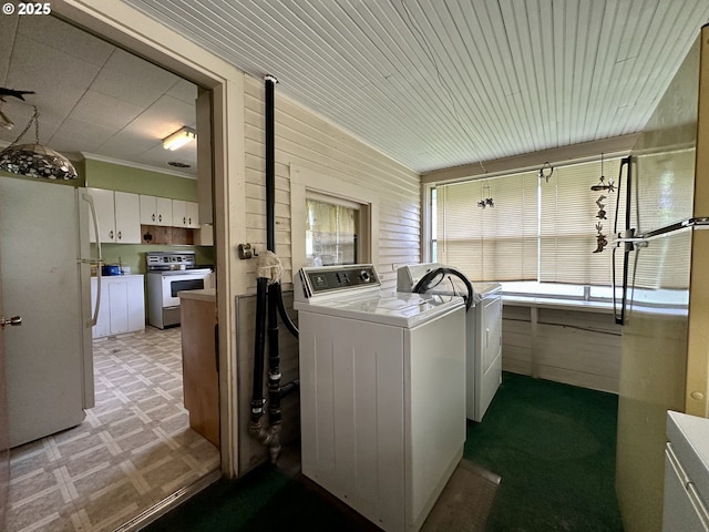 808 F Ave, La Grande, OR 97850 - laundry area featuring independent washer and dryer, light floors, and wooden walls