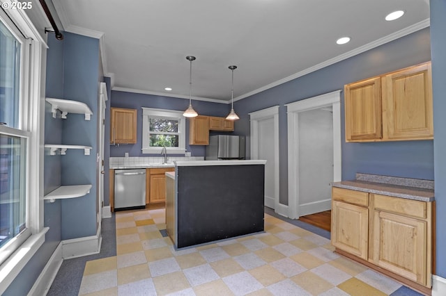3607 NE 13th Ave, Portland, OR 97212 - kitchen with stainless steel appliances, a center island, baseboards, ornamental molding, and recessed lighting