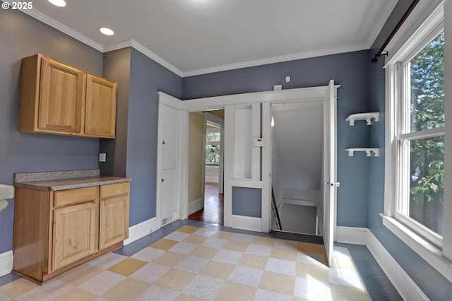 3607 NE 13th Ave, Portland, OR 97212 - kitchen featuring baseboards, ornamental molding, recessed lighting, dark countertops, and light flooring