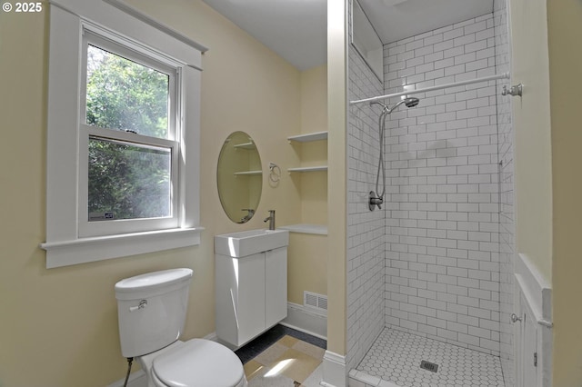 3607 NE 13th Ave, Portland, OR 97212 - full bathroom featuring a shower stall, toilet, vanity, and built in shelves