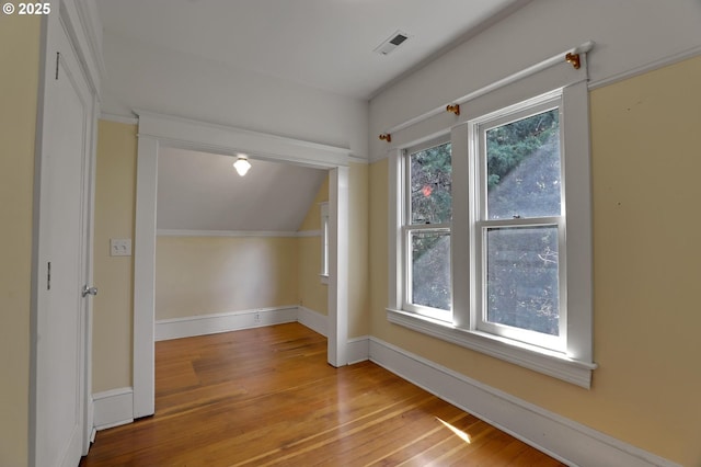 3607 NE 13th Ave, Portland, OR 97212 - additional living space with hardwood / wood-style flooring, baseboards, and vaulted ceiling