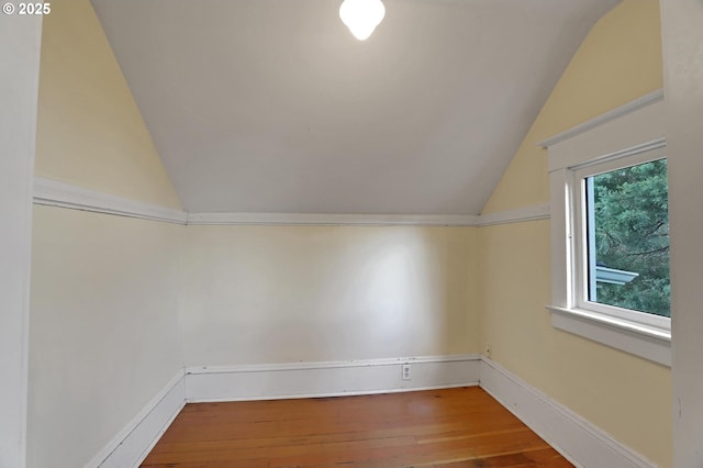 3607 NE 13th Ave, Portland, OR 97212 - additional living space featuring vaulted ceiling, hardwood / wood-style floors, and baseboards