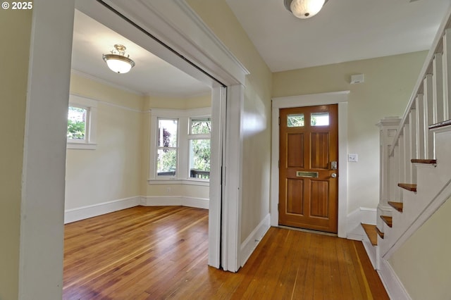3607 NE 13th Ave, Portland, OR 97212 - entryway featuring hardwood / wood-style floors, stairs, baseboards, and ornamental molding