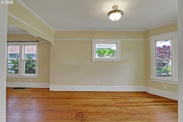3607 NE 13th Ave, Portland, OR 97212 - unfurnished room featuring hardwood / wood-style flooring, healthy amount of natural light, baseboards, and ornamental molding