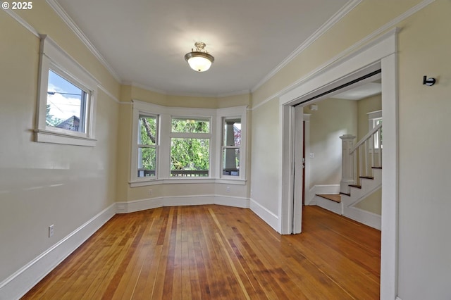 3607 NE 13th Ave, Portland, OR 97212 - spare room featuring hardwood / wood-style floors, stairs, baseboards, and crown molding