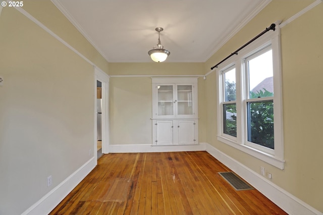 3607 NE 13th Ave, Portland, OR 97212 - unfurnished dining area with hardwood / wood-style flooring, baseboards, and ornamental molding
