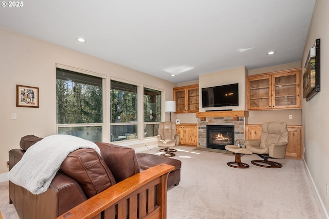 carpeted living room with a fireplace