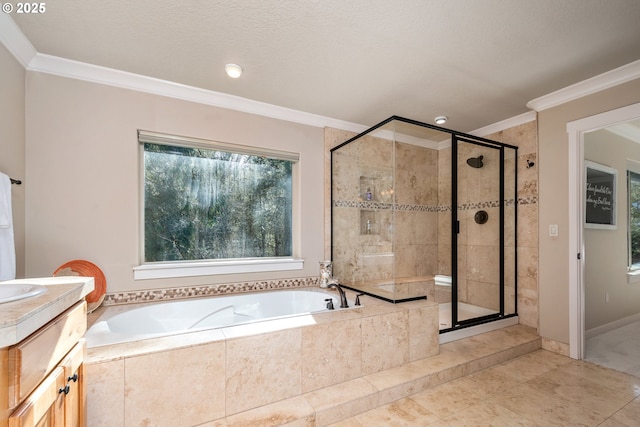 bathroom with vanity, ornamental molding, and plus walk in shower