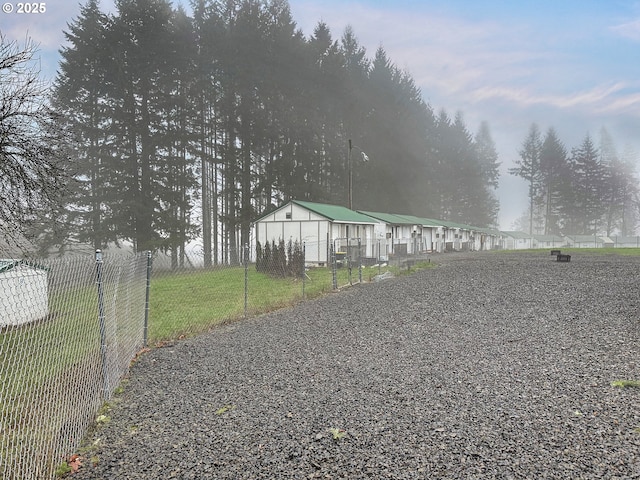 view of front of house featuring fence