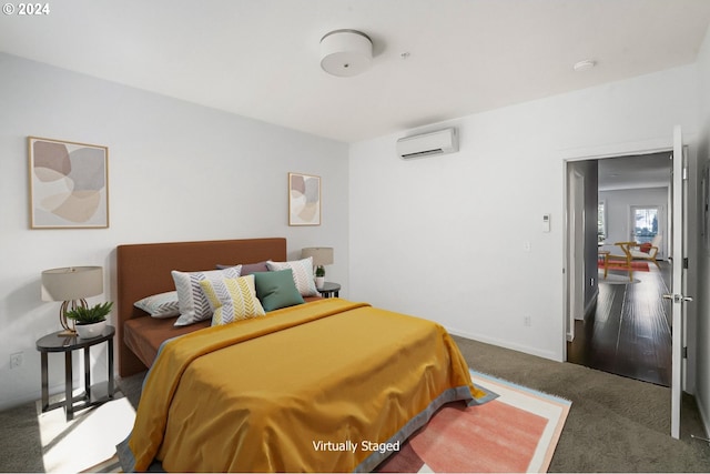 carpeted bedroom with a wall unit AC