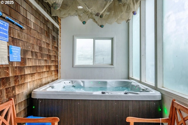 full bathroom with a tub with jets