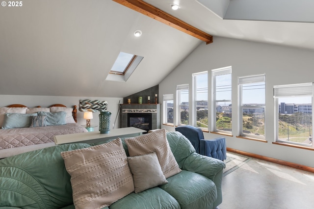 bedroom featuring a skylight, a tile fireplace, baseboards, and recessed lighting
