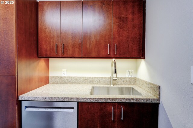 2020 SW Main St Unit 403, Portland, OR 97205 - kitchen featuring stainless steel dishwasher, a sink, and light countertops