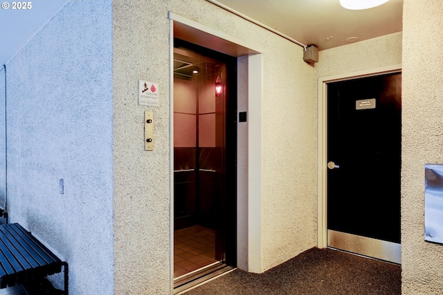 2020 SW Main St Unit 403, Portland, OR 97205 - corridor with elevator and a textured wall