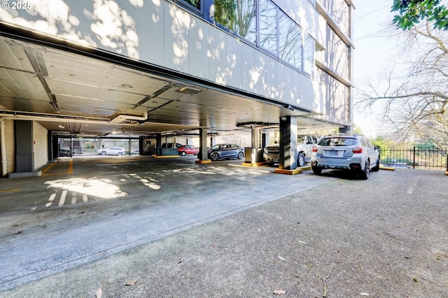 2020 SW Main St Unit 403, Portland, OR 97205 - view of vehicle parking with fence