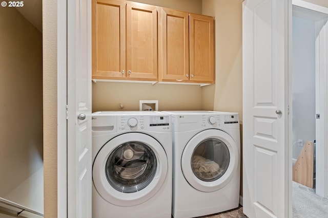 clothes washing area featuring washing machine and clothes dryer