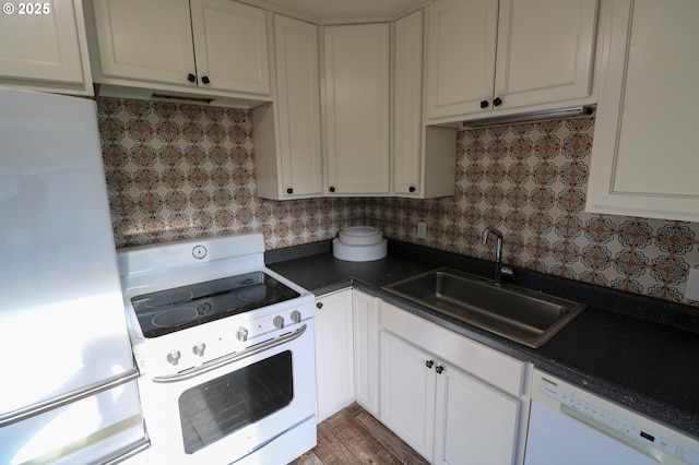 kitchen featuring white cabinets, white appliances, sink, and tasteful backsplash