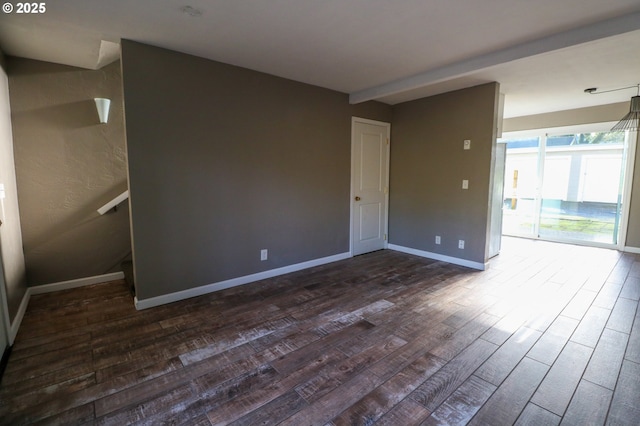 unfurnished room featuring dark hardwood / wood-style flooring