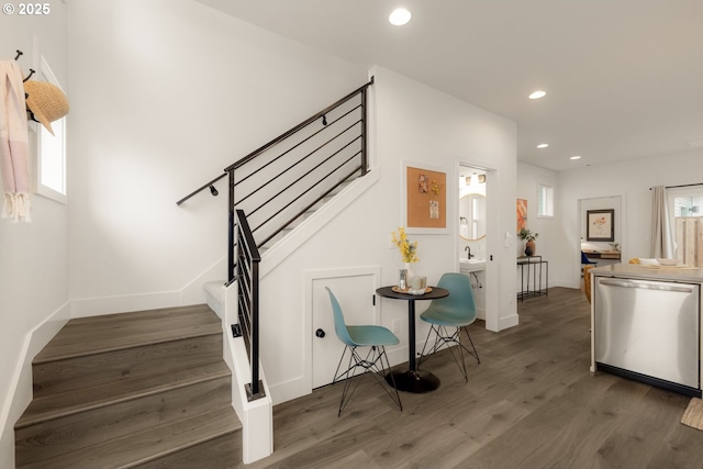 stairway featuring recessed lighting, baseboards, and wood finished floors